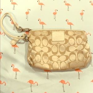 COACH off white wristlet with silver hardware